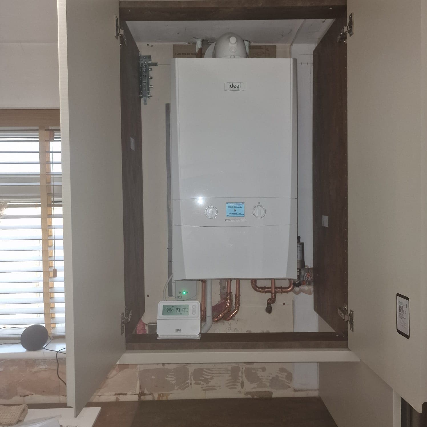 An Ideal boiler, fitted in an airing cupboard